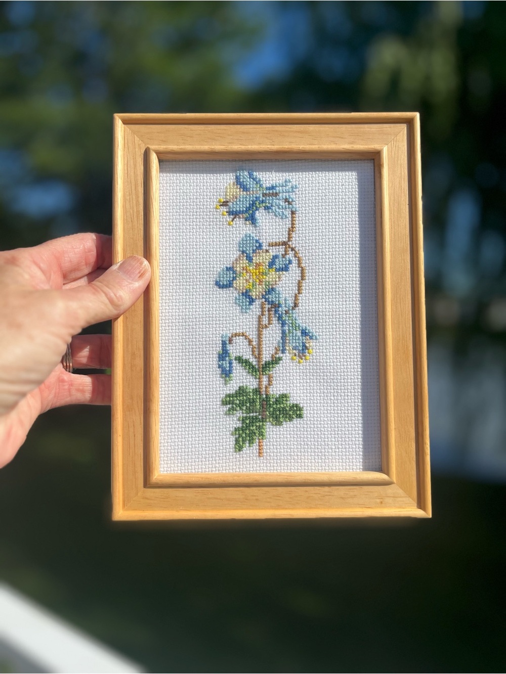 Framed Blue and Yellow Floral Cross-Stitch Art -glass natural wood frame